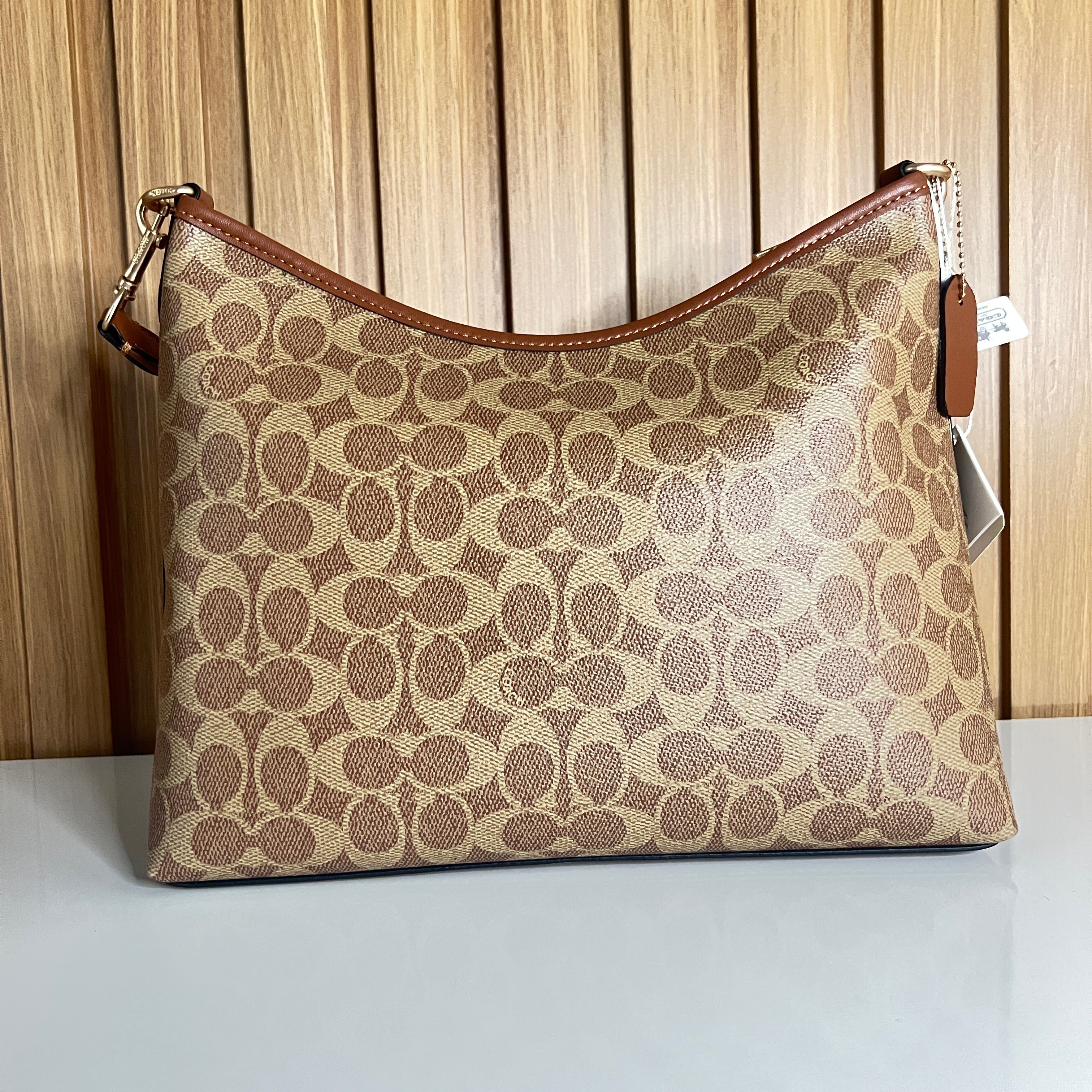 Logo Print Hobo Shoulder Bag – Khaki & Saddle with Crossbody Strap by Meraki by Emaan Pakistan