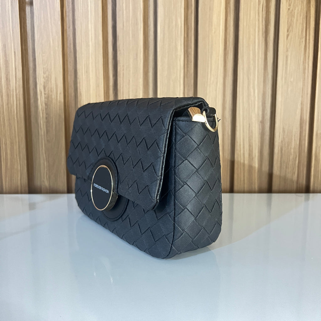 Bloack woven basket-weave crossbody bag side view gold hardware – Meraki by Emaan Pakistan