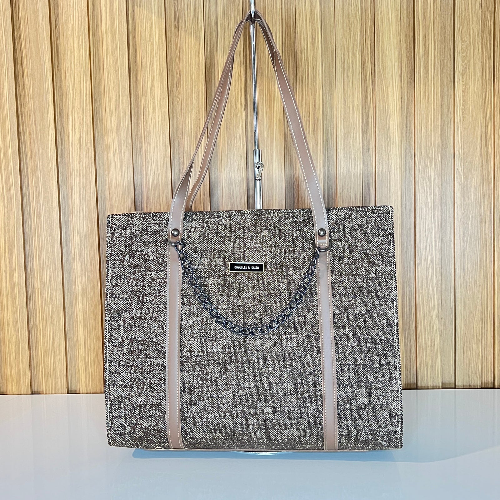 Brown tweed tote bag side view with chain detail and nude leather straps – Meraki by Emaan Pakistan