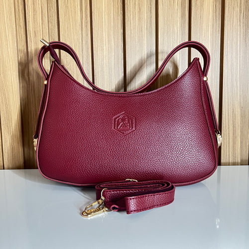 Burgundy pebbled leather crescent hobo shoulder bag front with crossbody strap – Meraki by Emaan Pakistan