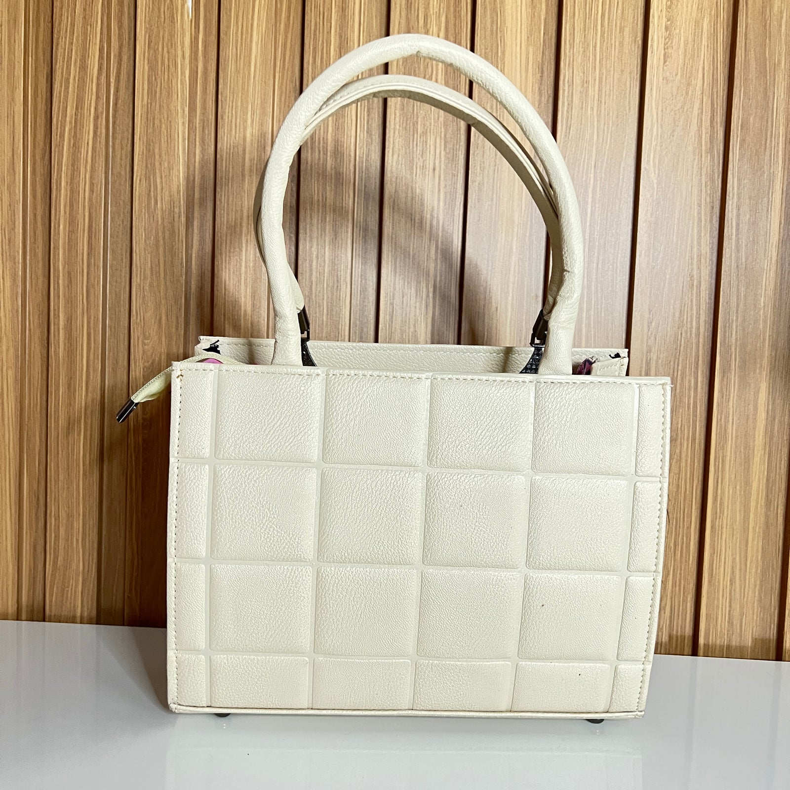 Cream quilted square-embossed handbag back view – Meraki by Emaan Pakistan
