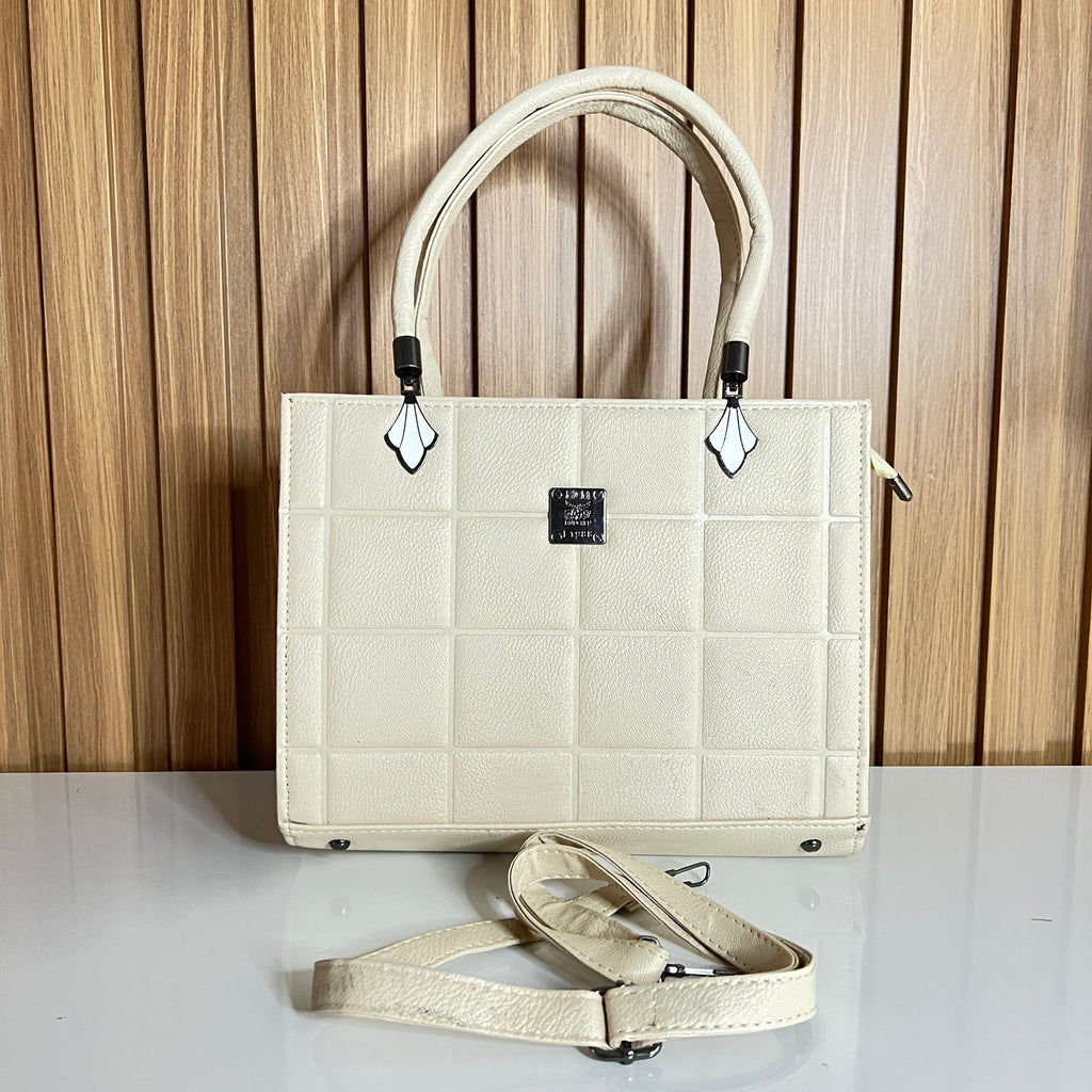 Cream quilted structured bag front view with crossbody strap – Meraki by Emaan Pakistan