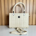 Cream quilted structured bag front view with crossbody strap – Meraki by Emaan Pakistan