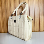 Cream structured handbag side view with diamond zipper pull – Meraki by Emaan Pakistan