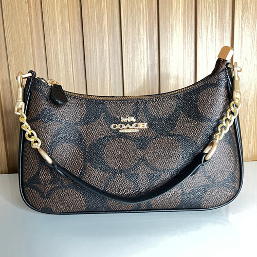 Logo Print Crescent Shoulder Bag – Brown & Black with Gold Chain Strap by Meraki by Emaan Pakistan - Front View with Mini Strap