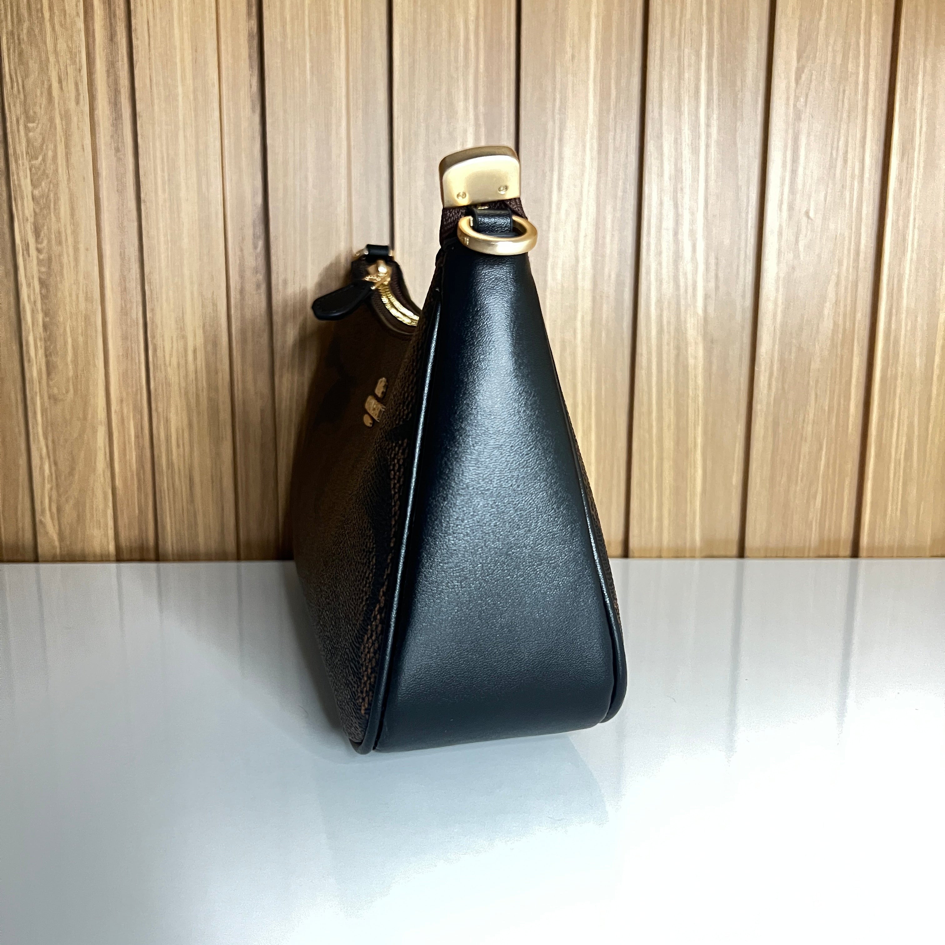 Logo Print Crescent Shoulder Bag – Brown & Black with Gold Chain Strap by Meraki by Emaan Pakistan - Side View