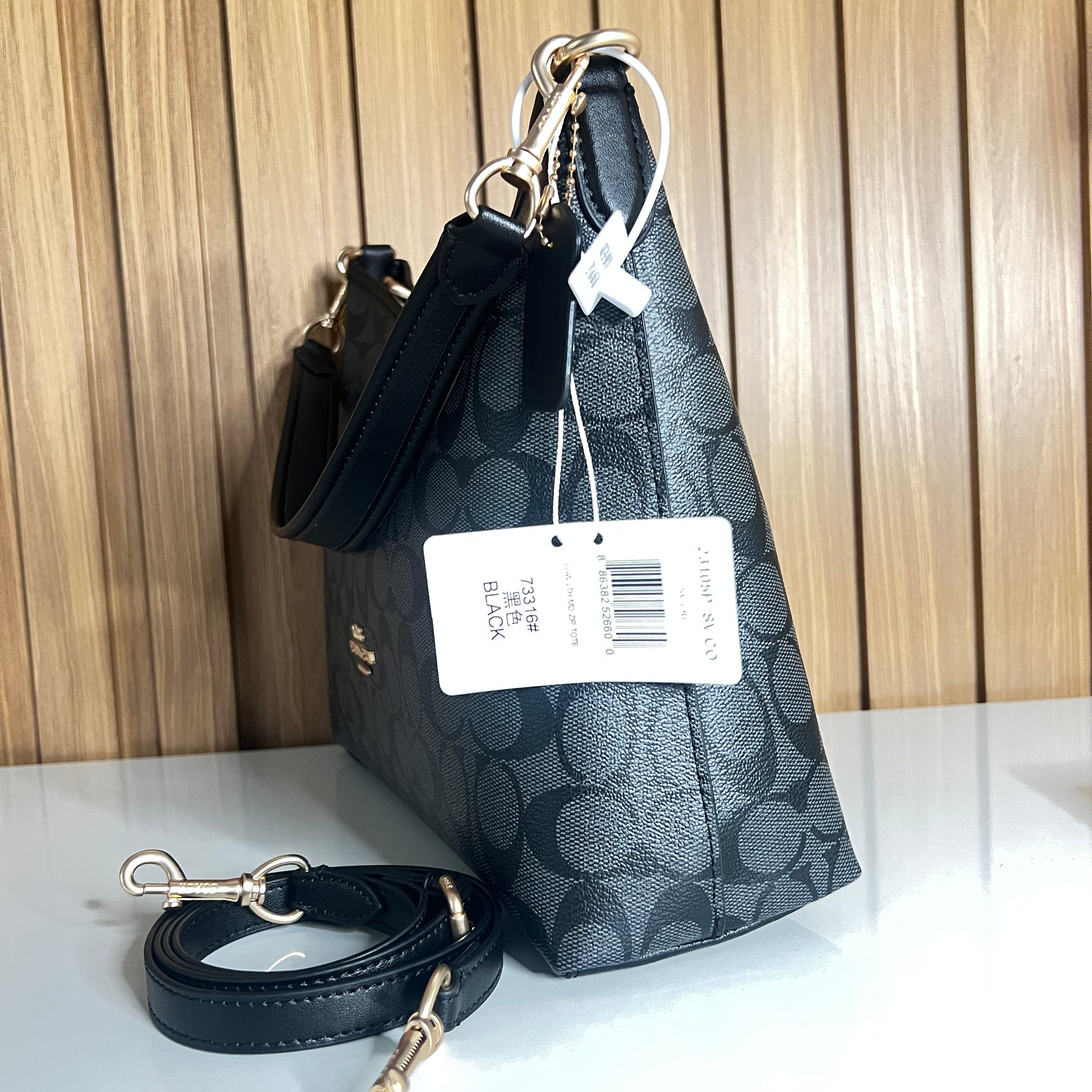 Logo Print Hobo Shoulder Bag – Charcoal & Black with Crossbody Strap by Meraki by Emaan Pakistan - Side View