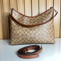 Logo Print Hobo Shoulder Bag – Khaki & Saddle with Crossbody Strap by Meraki by Emaan Pakistan - Front View