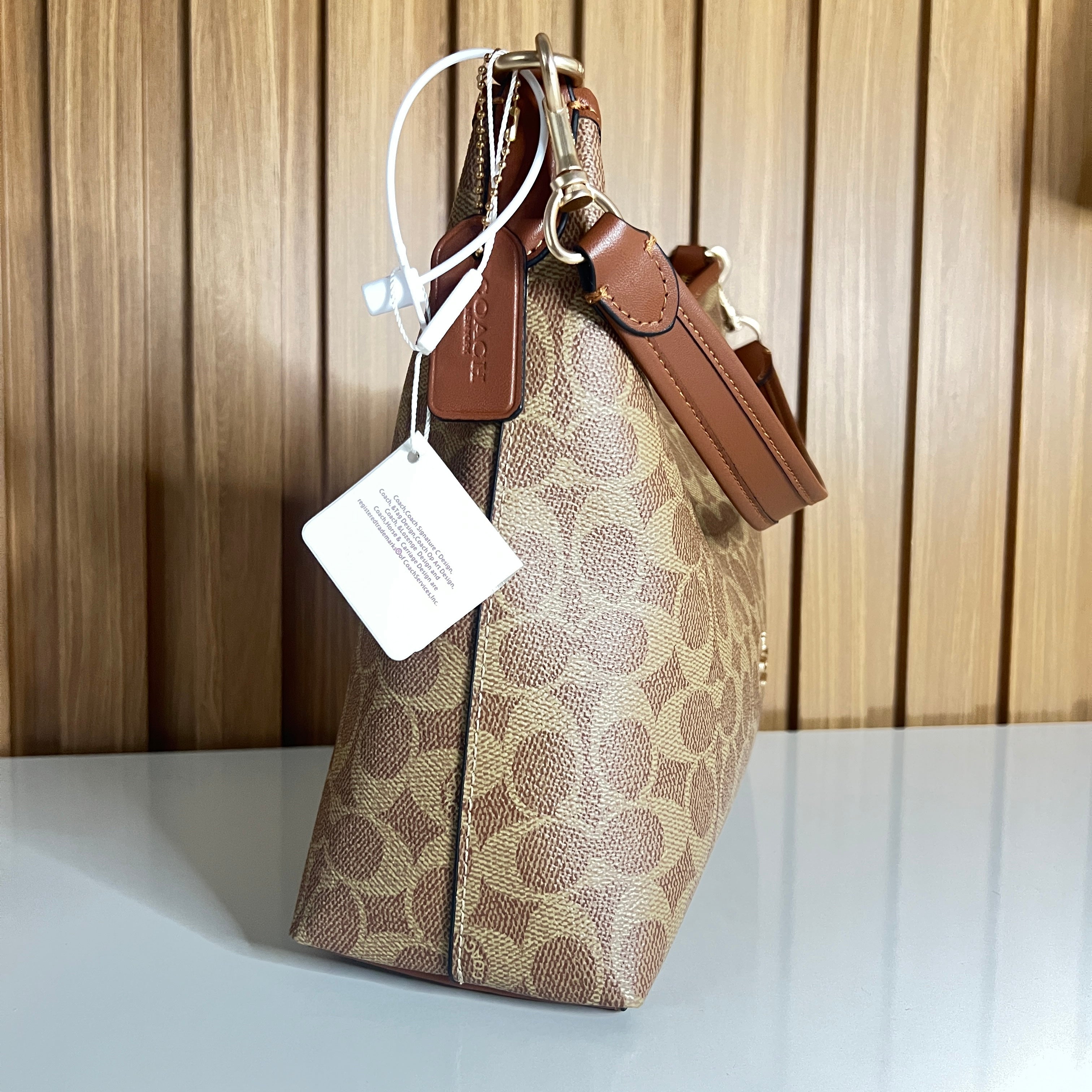 Logo Print Hobo Shoulder Bag – Khaki & Saddle with Crossbody Strap by Meraki by Emaan Pakistan - Side View