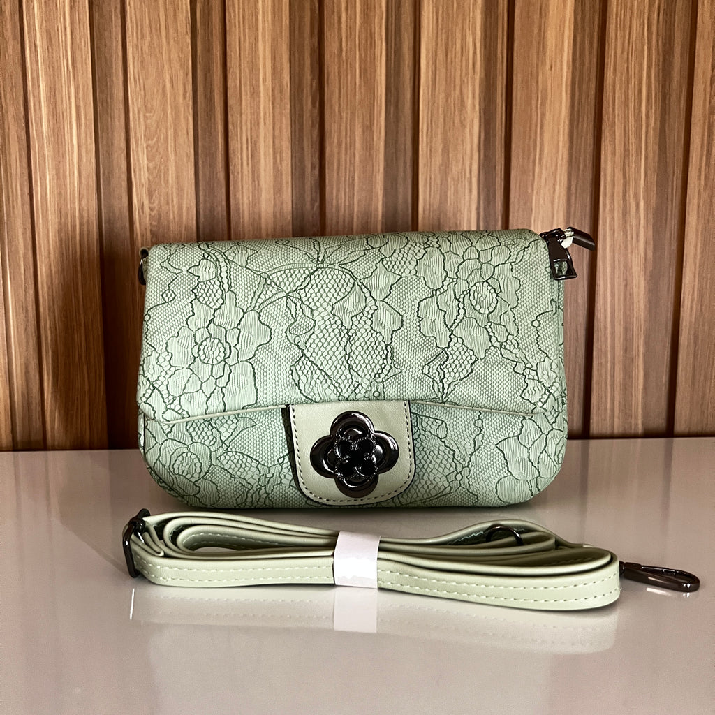 Mint green floral lace-embossed crossbody bag front view with flower clasp and strap – Meraki by Emaan Pakistan
