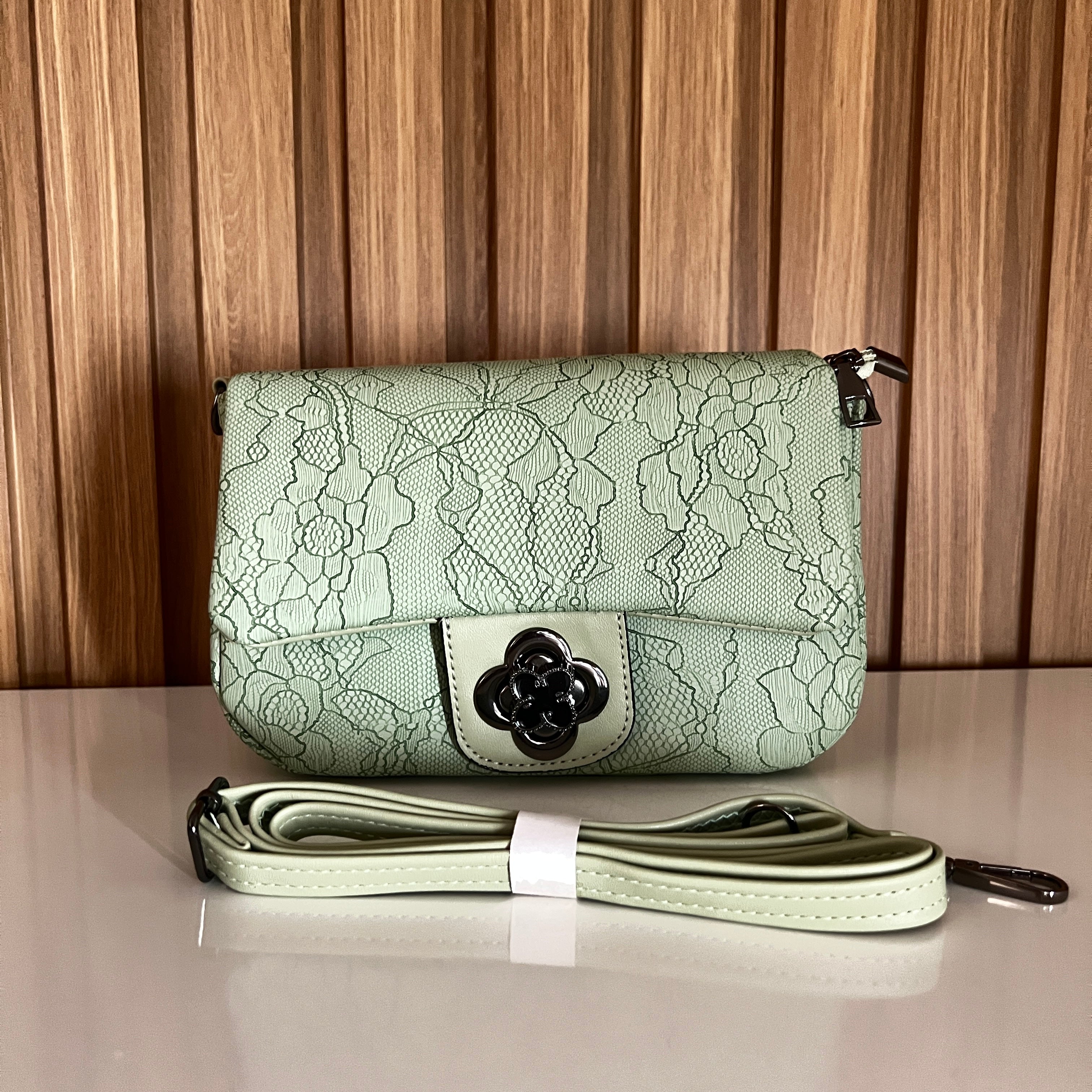 Mint green floral lace-embossed crossbody bag front view with flower clasp and strap – Meraki by Emaan Pakistan