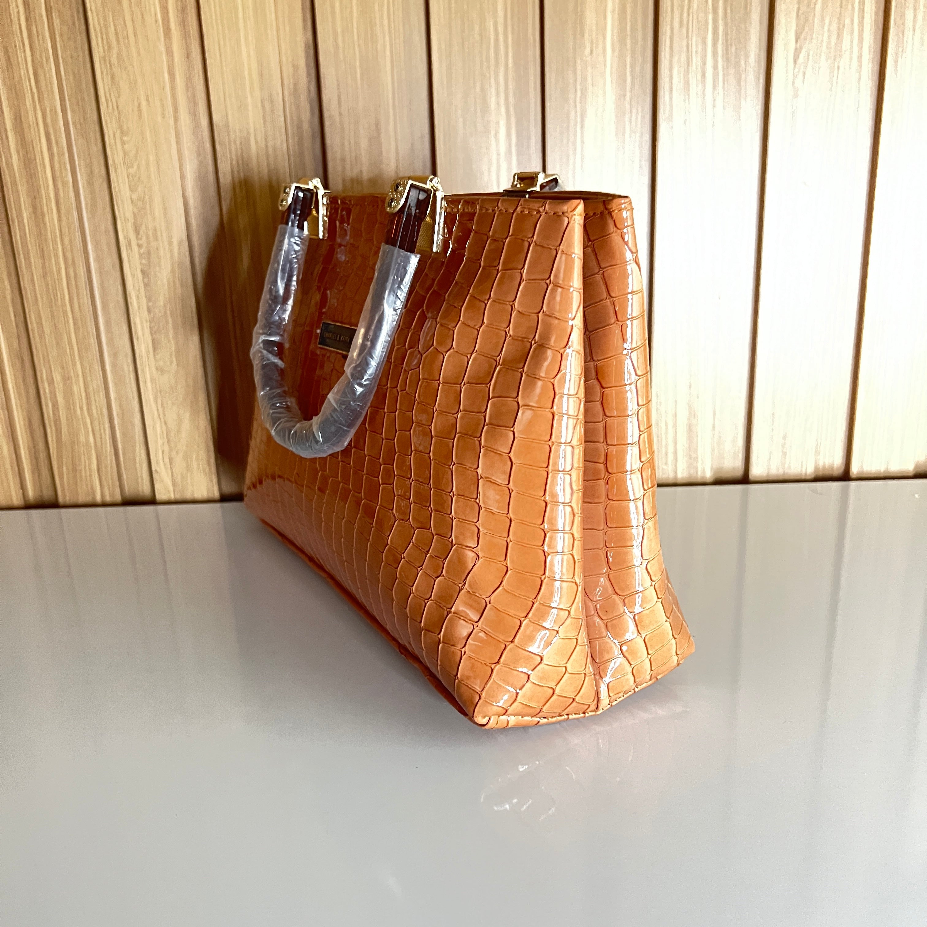 Peach croc-embossed structured handbag side angle gold hardware – Meraki by Emaan Pakistan