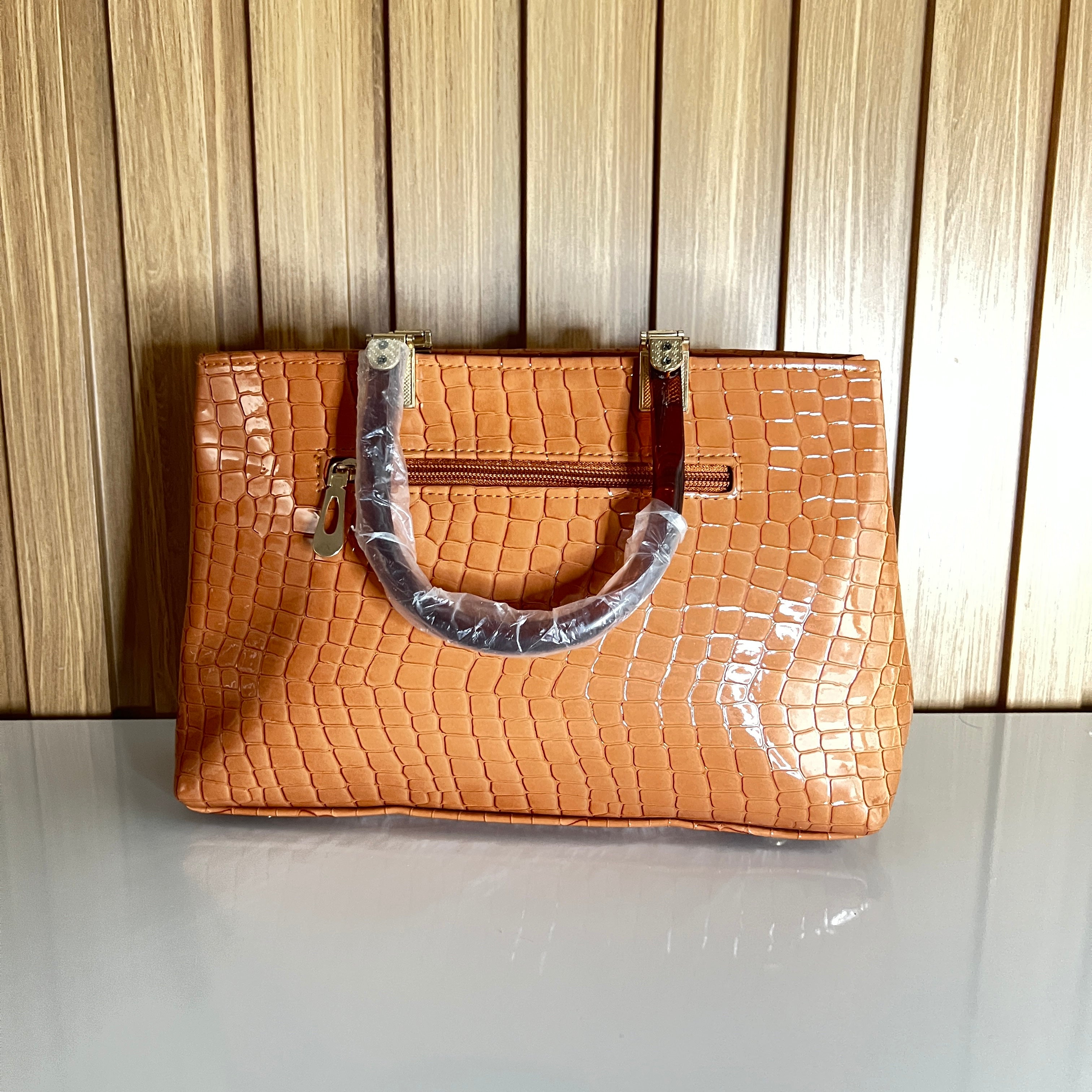 Peach glossy croc handbag back view – Meraki by Emaan Pakistan