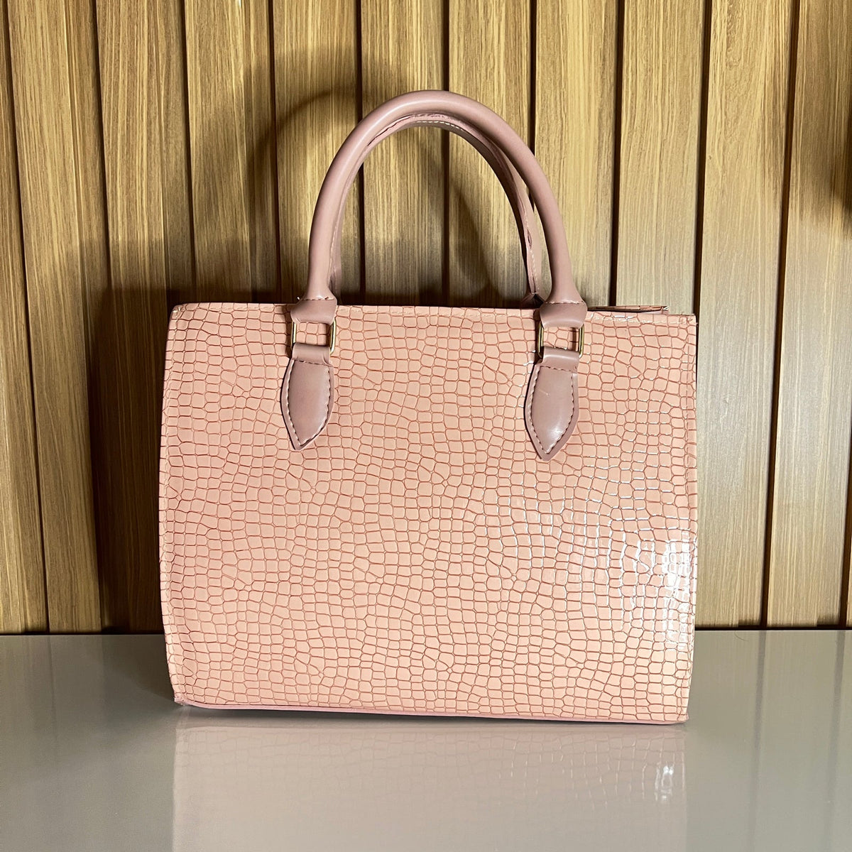 Pink croc-embossed structured handbag back view – Meraki by Emaan Pakistan