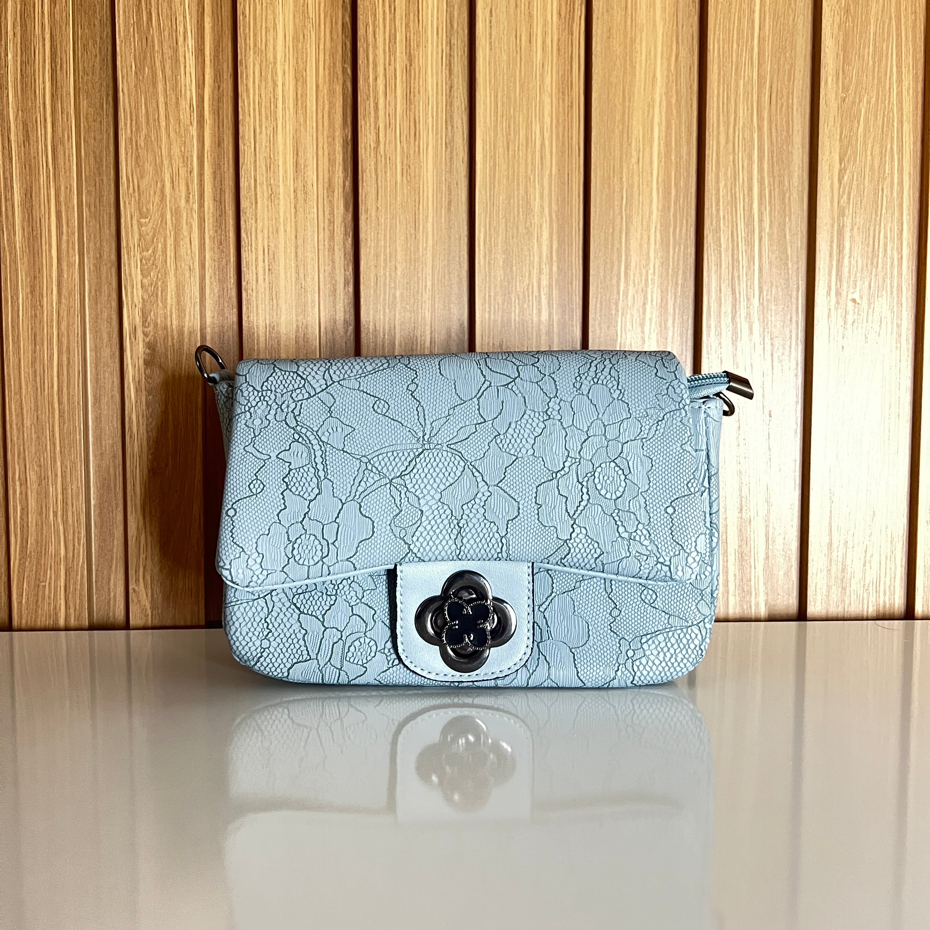 Powder blue floral crossbody bag front view with flower clasp - Meraki by Emaan Pakistan