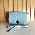 Powder blue floral crossbody bag front view with flower clasp and strap – Meraki by Emaan Pakistan