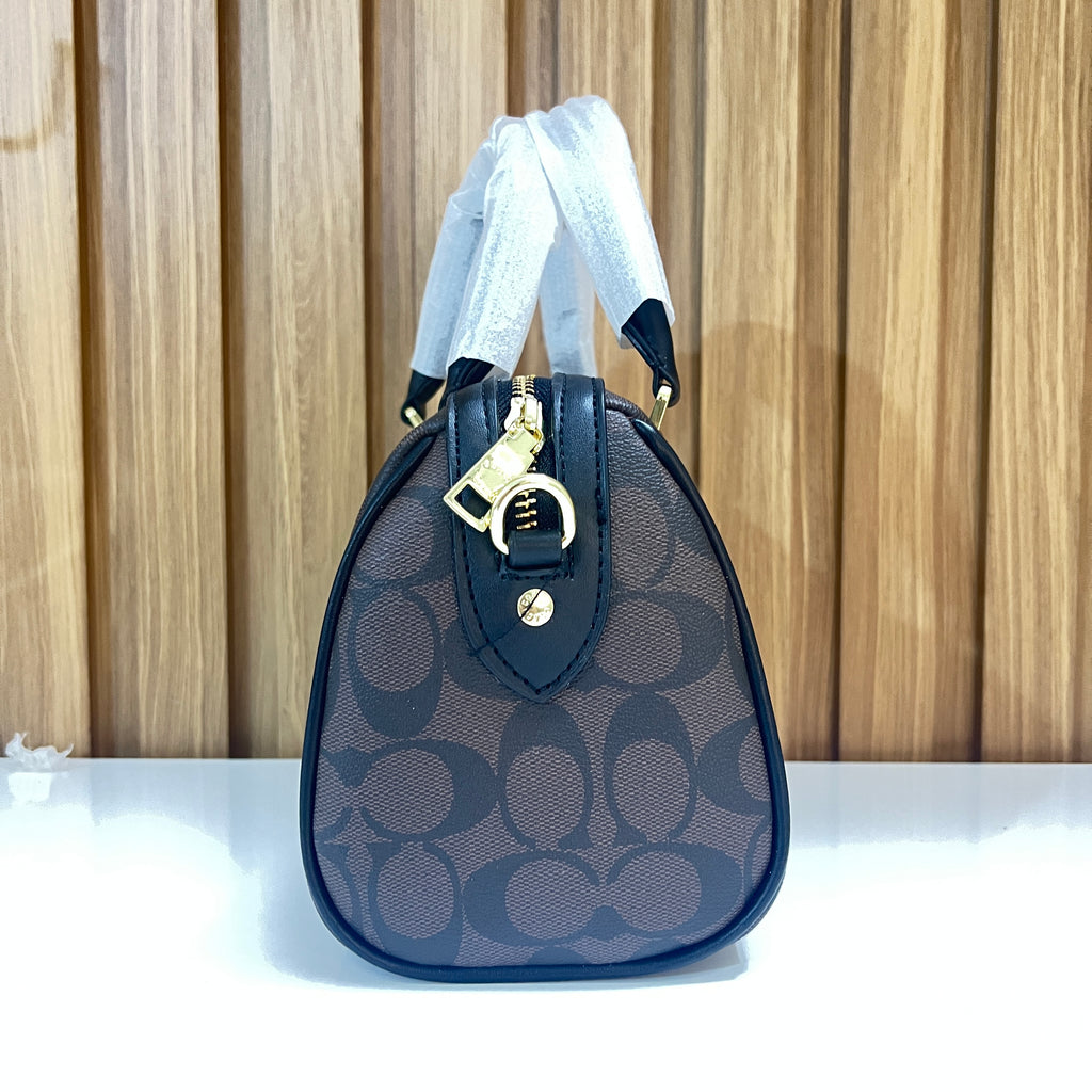 Signature Monogram Mini Barrel Bag – Brown & Black Top Handle & Crossbody Bag by Meraki by Emaan Pakistan - Side view
