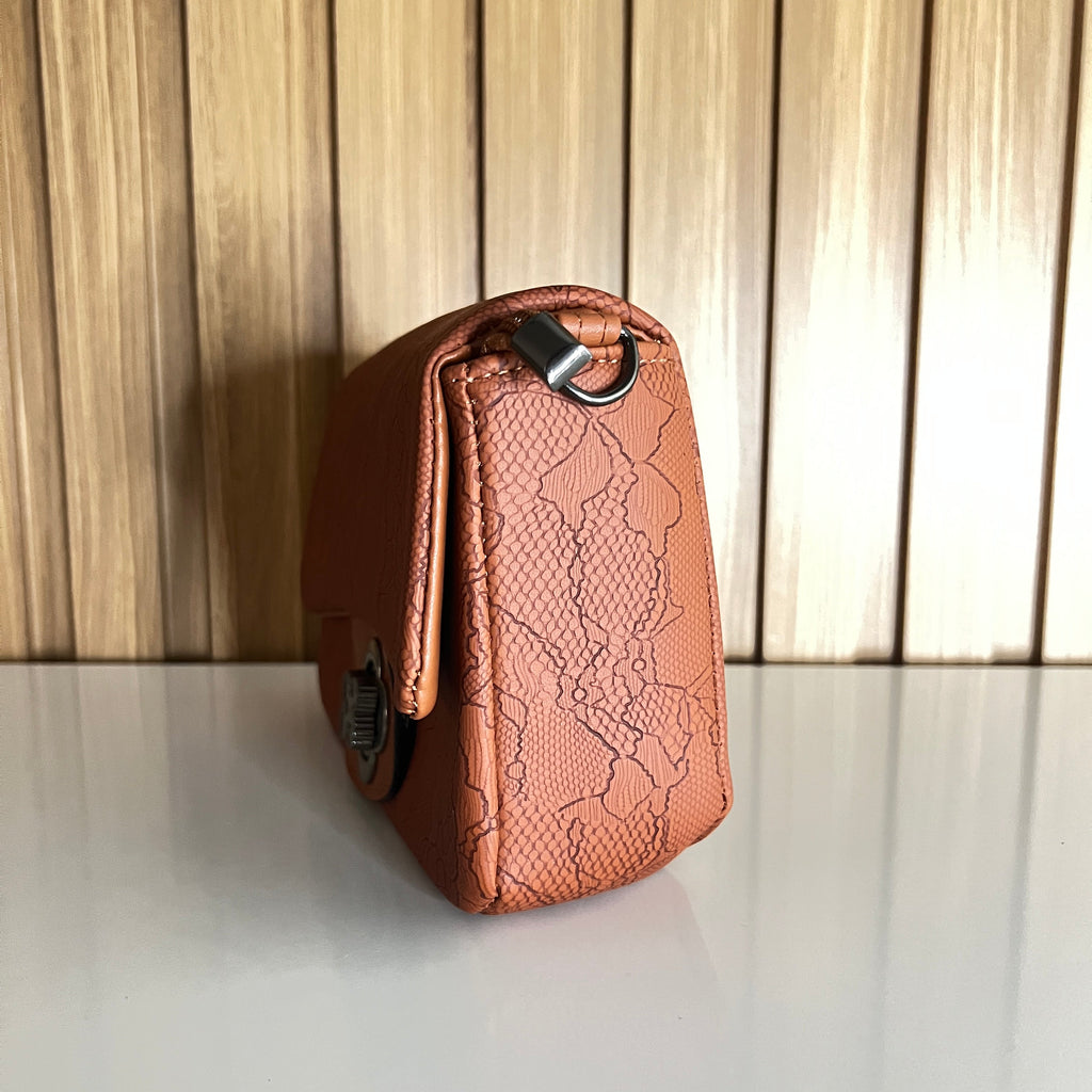 Tan lace-embossed crossbody bag side view gunmetal hardware – Meraki by Emaan Pakistan