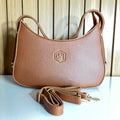 Tan pebbled leather crescent hobo shoulder bag front with crossbody strap – Meraki by Emaan Pakistan