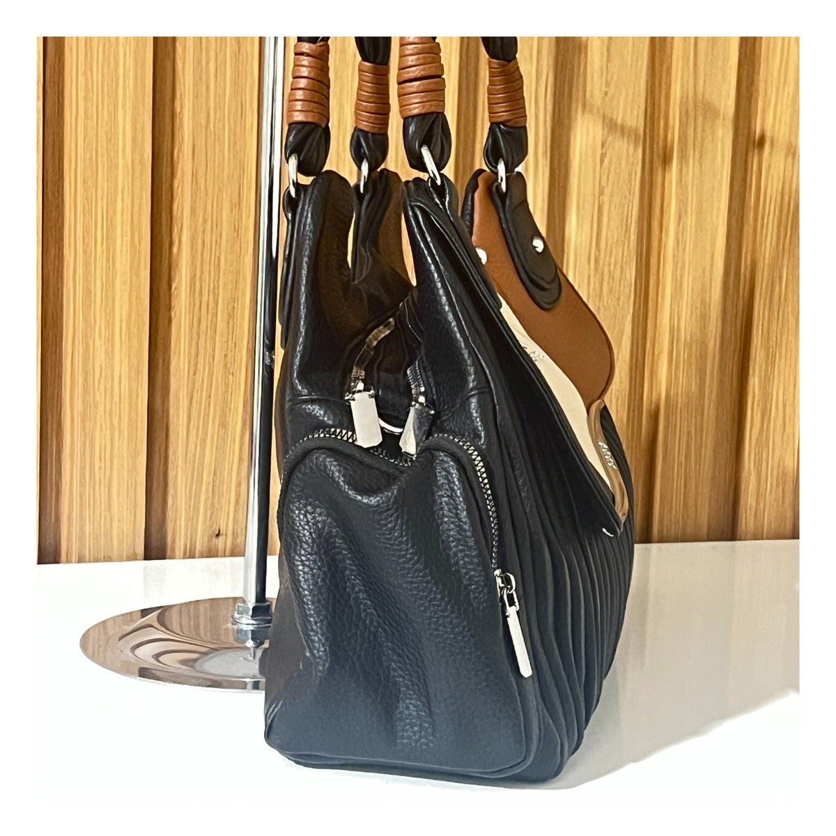 Black brown and cream pleated handbag for women side view