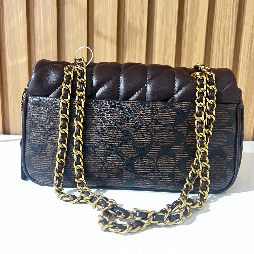Black quilted chain shoulder bag for women front view