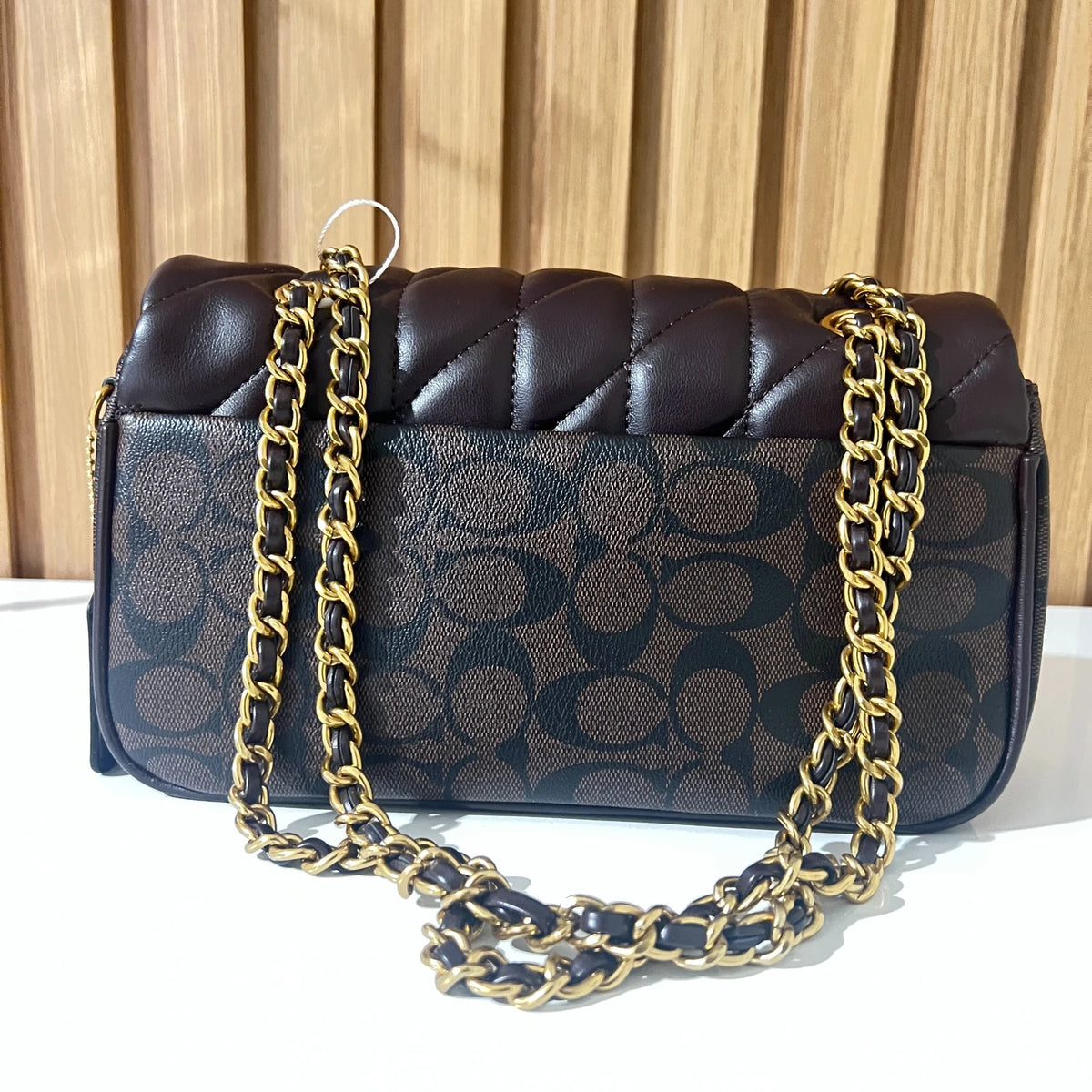 Black quilted chain shoulder bag for women front view
