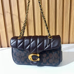 Black quilted chain shoulder bag worn as shoulder bag