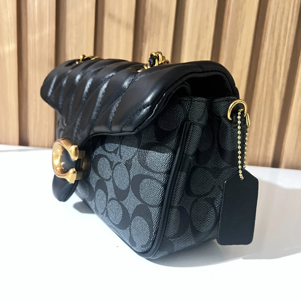 Black quilted chain shoulder bag for women side view with gold chain strap