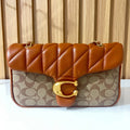 Cognac quilted chain shoulder bag for women front view with gold clasp