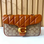 Cognac quilted chain shoulder bag for women front view with gold clasp