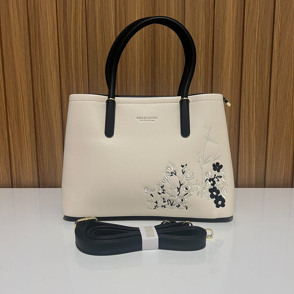 Cream and black embroidered tote handbag for women front view