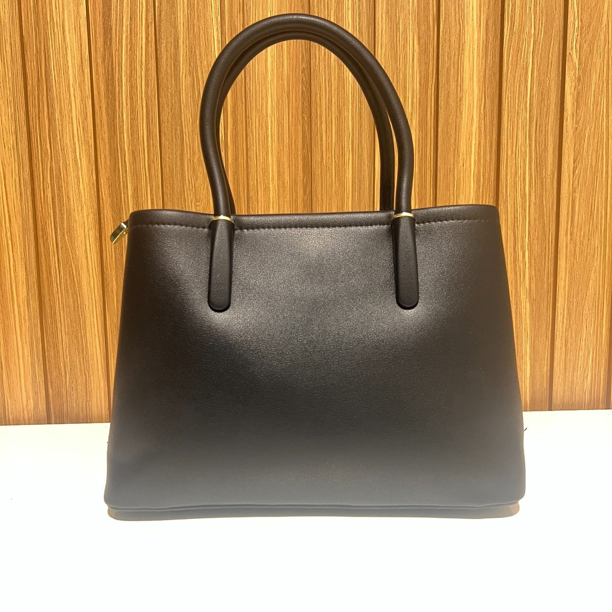 Cream and black women's tote handbag back view